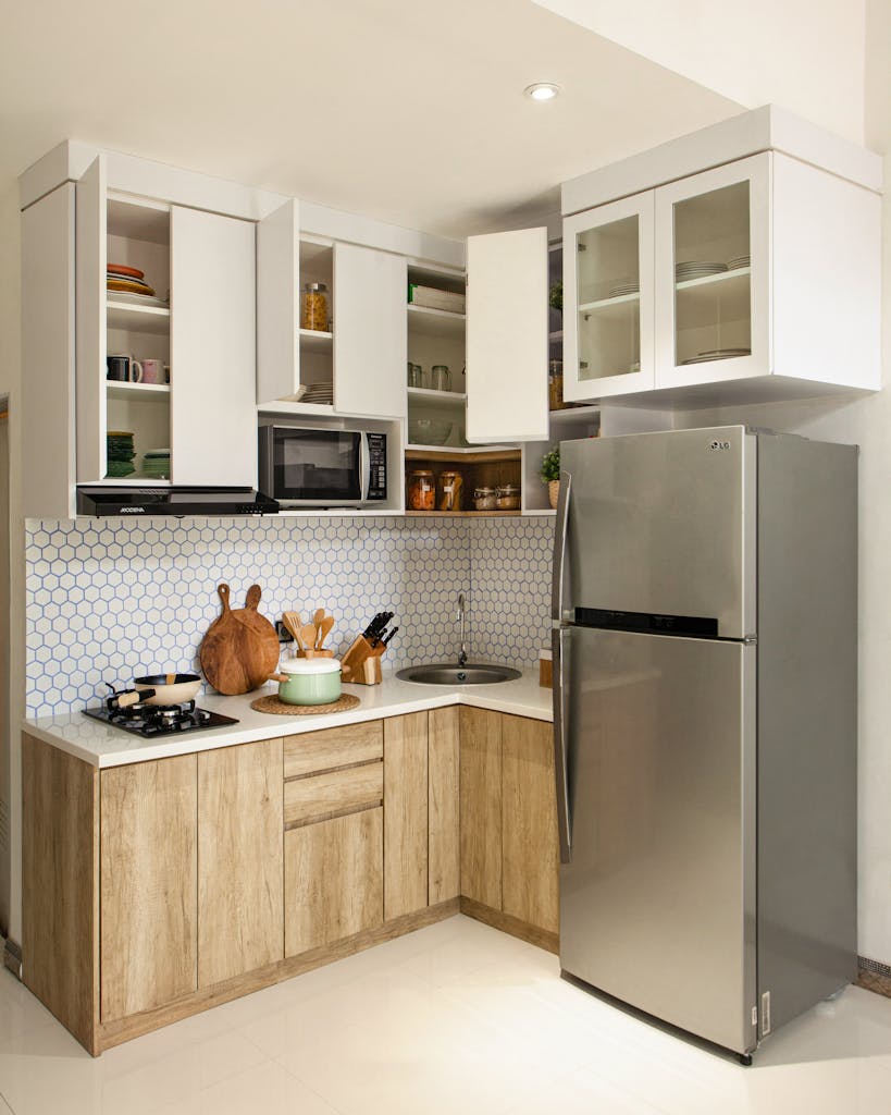 Sleek kitchen with stainless steel appliances and wooden accents.