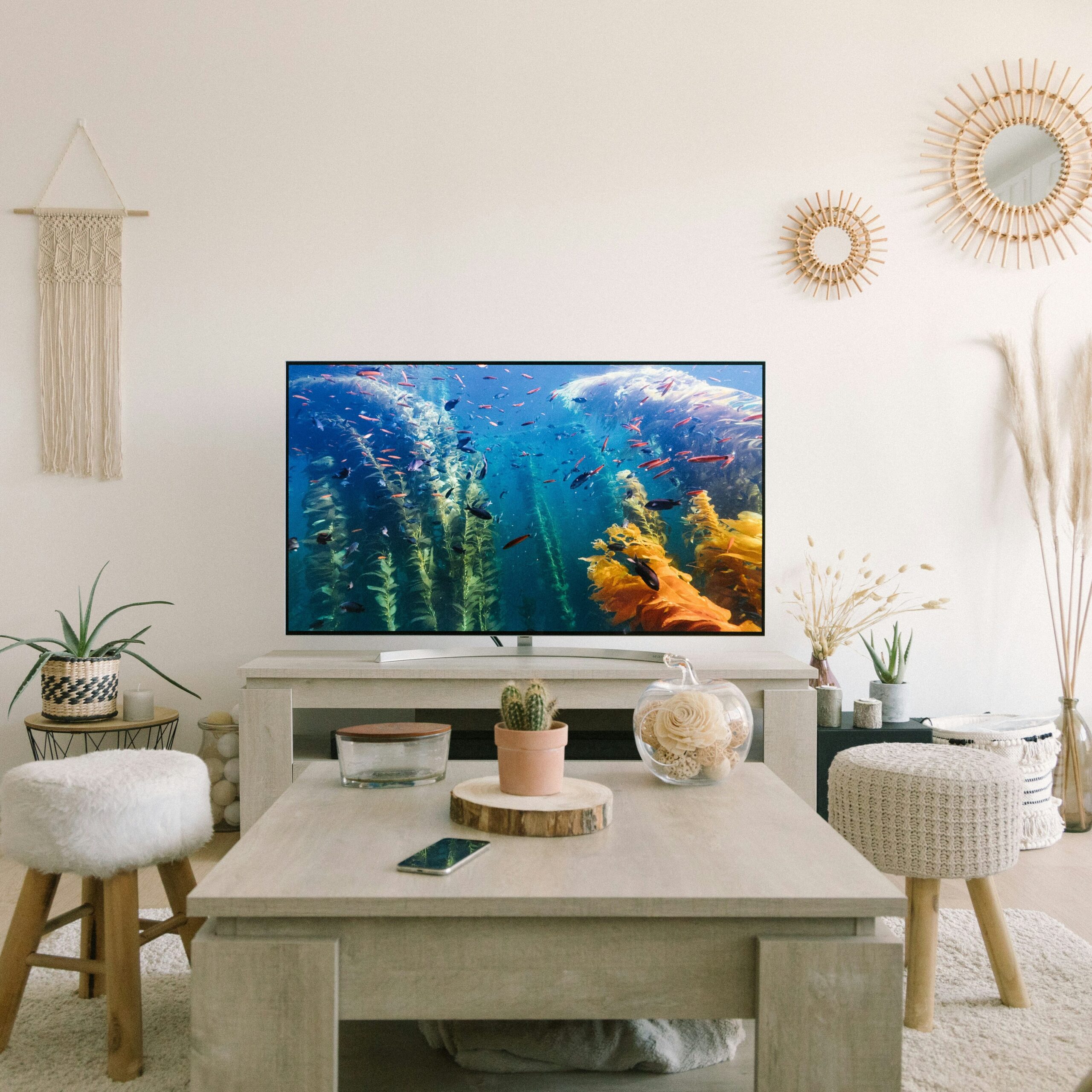 small living room with a television and a bohemian style.