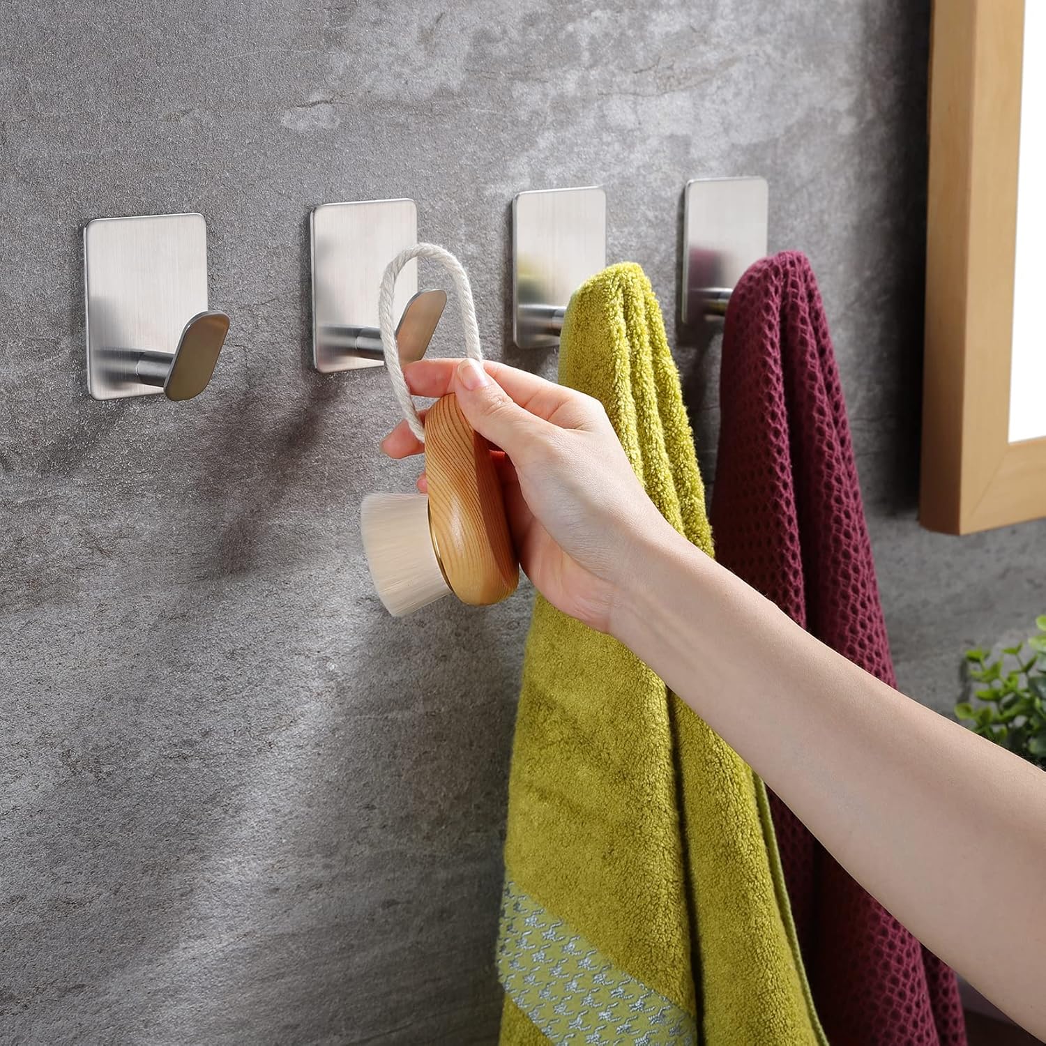Adhesive hooks for bathroom organization